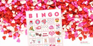 Valentines Day party game perfect for any group! Get 40 printable bingo game cards now - a perfect holiday theme for a Valentines Day party with kids or Valentines Day party for adults or office parties. With words and pictures and instructions for how to play, these bingo cards you’ll find the perfect games & ideas for your Valentines Day party!