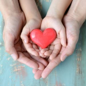 hands holding red heart