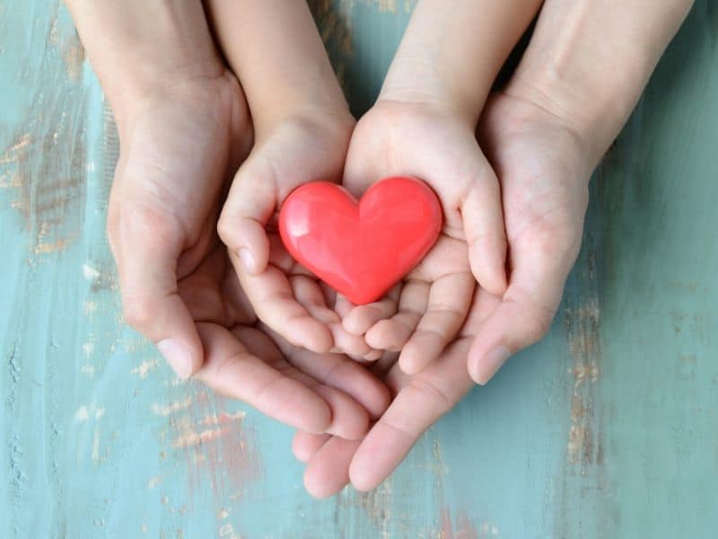 hands holding red heart